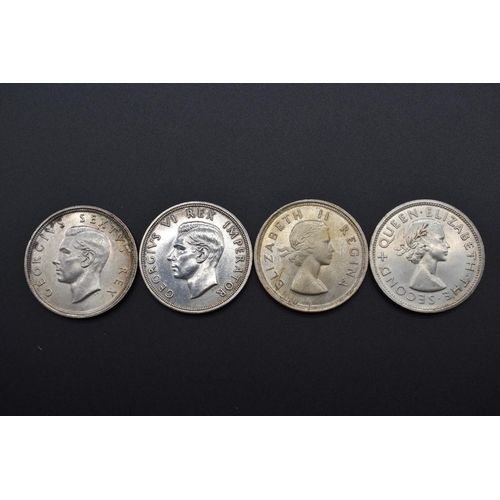 156 - Coins: a Southern Rhodesia 1953 Cecil Rhodes commemorative silver crown; together with three South A... 