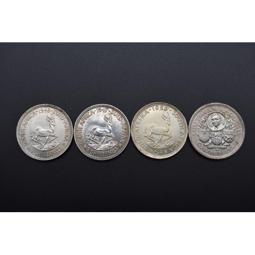 156 - Coins: a Southern Rhodesia 1953 Cecil Rhodes commemorative silver crown; together with three South A... 