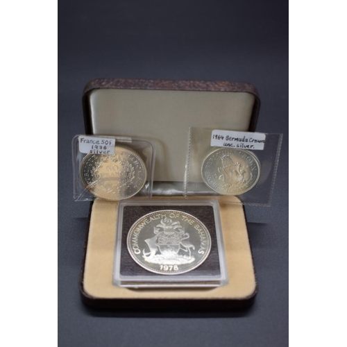 162 - Coins: a Commonwealth of the Bahamas 1978 silver $10 commemorative coin; together with a French 1976... 