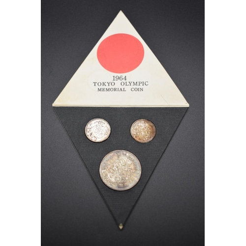 165 - Coins: a Mitsui Bank 1964 Tokyo Olympics three coin memorial set.