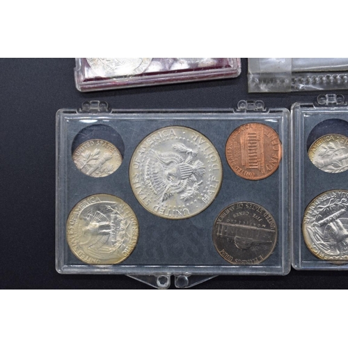 166 - Coins: a small quantity of US coinage to include: eleven dollar coins; and four 1964 uncirculated co... 