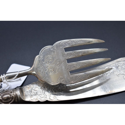 17 - A Victorian silver fish knife and fork, by Joseph & Horace Savory, London 1890, having spiral ca... 