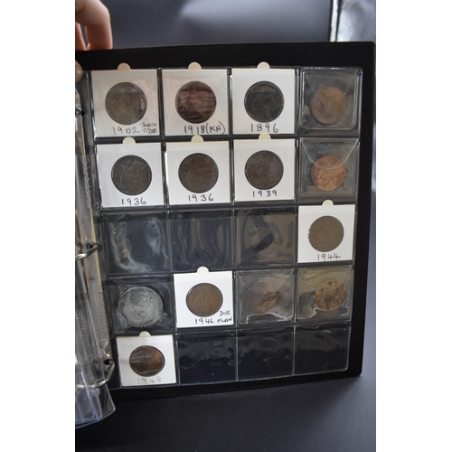 174 - Coins: an interesting album of UK and other coins and tokens, mostly 19th century, to include: token... 