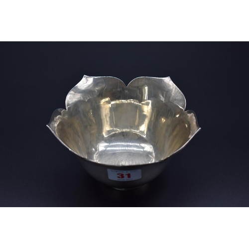 31 - An Eastern white metal lotus shaped bowl, stamped 'sterling 925', 14cm diameter, 192g.... 