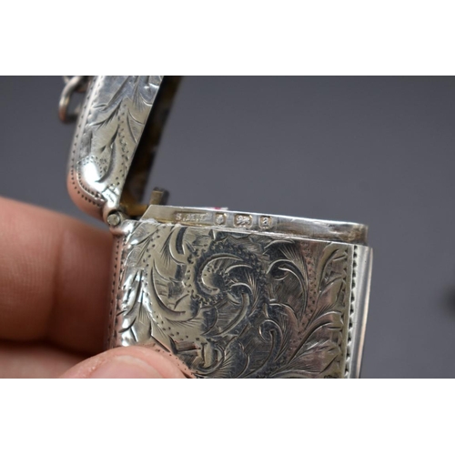 46 - A late Victorian silver vesta case, by Samuel M Levi, Birmingham 1900, 4.5cm; together with another ... 