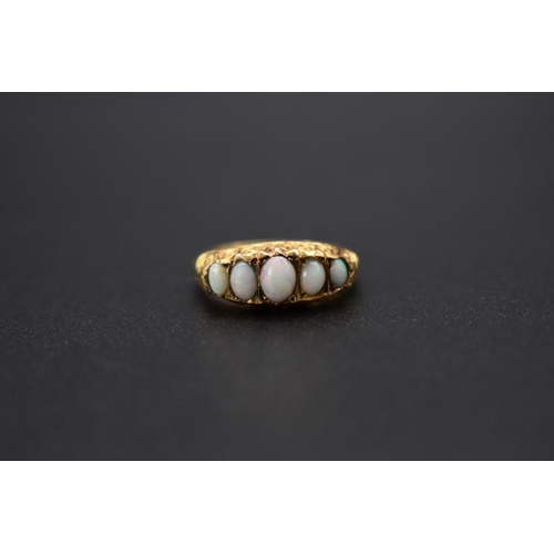 70 - An 18ct gold and opal five stone ring, total weight 2.4g, size K.