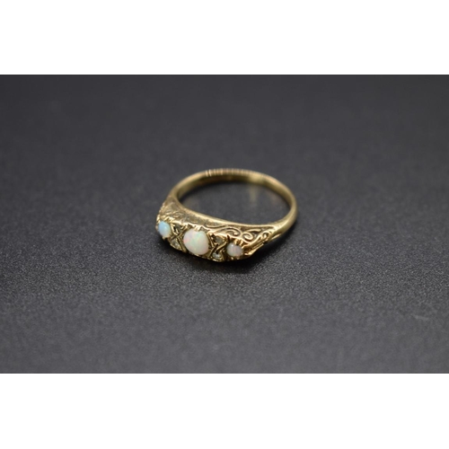 71 - A 9ct gold ring set three opals and four small diamonds, total weight 2.6g, size M1/2.... 