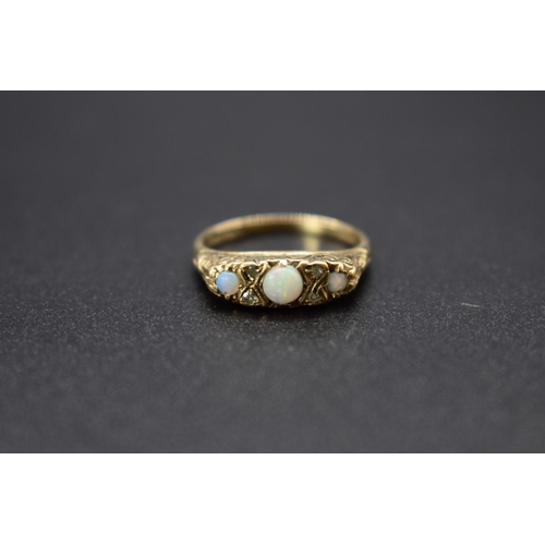 71 - A 9ct gold ring set three opals and four small diamonds, total weight 2.6g, size M1/2.... 