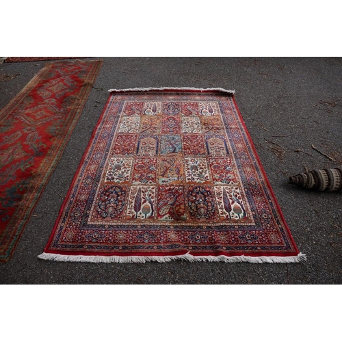 1076 - A Persian rug, having trees, birds and flowers to central field, 222 x 157cm.