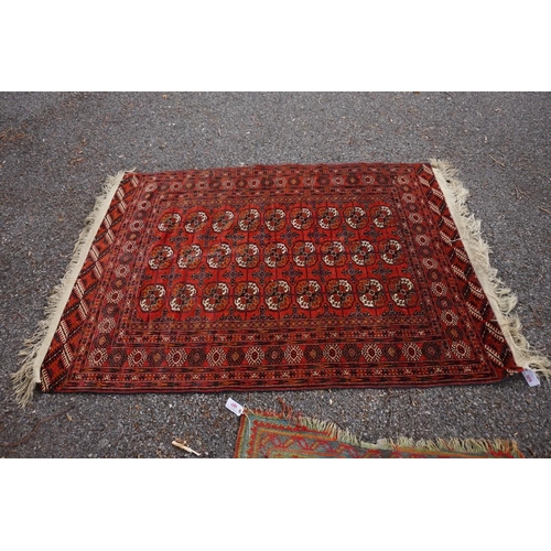 1078 - A Bokhara rug, having repeated design to central field, 184 x 132cm. 