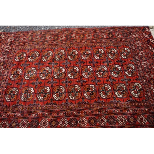 1078 - A Bokhara rug, having repeated design to central field, 184 x 132cm. 