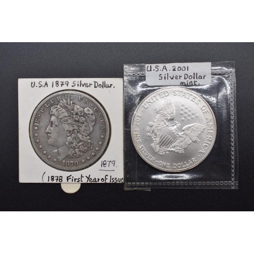 140 - Coins: a US 1879 Morgan silver dollar, New Orleans Mint; together with a US 2001 Liberty Eagle dolla... 