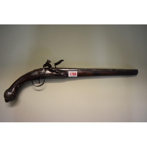 1788 - An antique flintlock pistol, having 33cm barrel, indistinctly signed to the barrel.