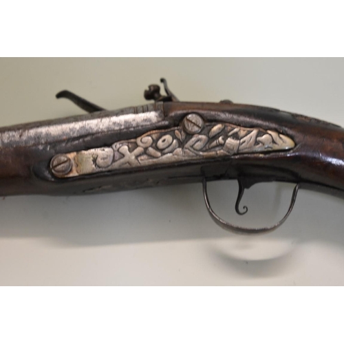 1788 - An antique flintlock pistol, having 33cm barrel, indistinctly signed to the barrel.