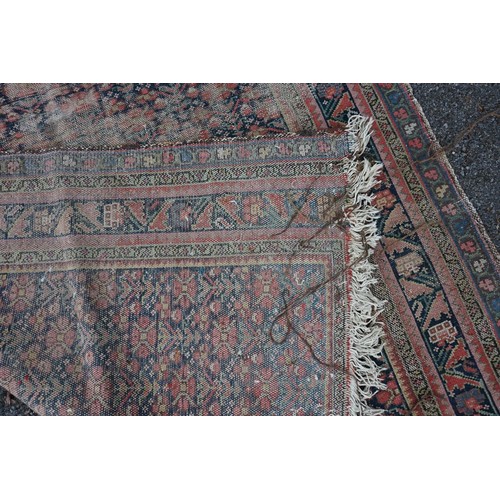 1076a - A North West Persian rug, having repeated floral decoration to central field with floral borders, 32... 