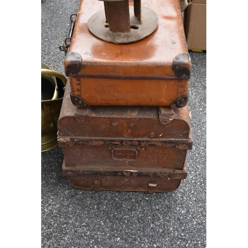 1061 - An old tin trunk; together with a leather suitcase, coal scuttle and two small cans and an old stage... 