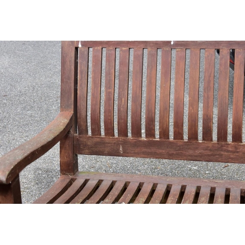 1064 - A wood garden bench, 153cm wide. Collection of this lot is strictly by appointment on Saturday 26th ... 