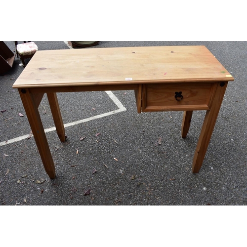 1065 - A modern wood desk, 107cm wide x 45cm deep. Collection of this lot is strictly by appointment on Sat... 