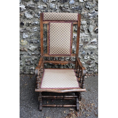 1067 - An antique American rocking chair, 106.5cm high. Collection of this lot is strictly by appointment o... 