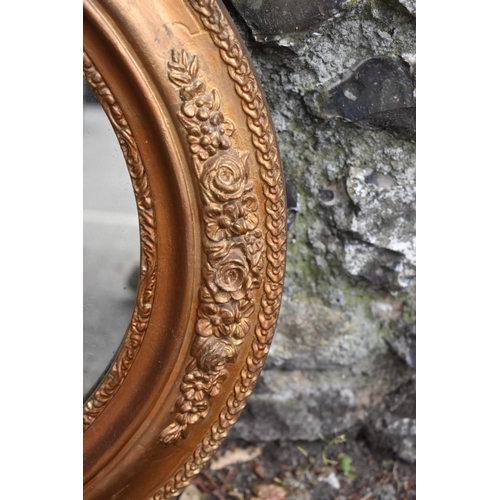 1072 - A gilt framed oval wall mirror, 71 x 60cm, (some chipping to gilt decoration). Collection of this lo... 