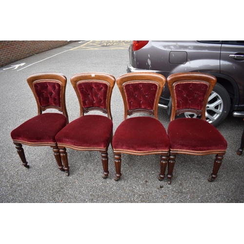 1073 - A set of four red upholstered dining chairs. Collection of this lot is strictly by appointment on Sa... 