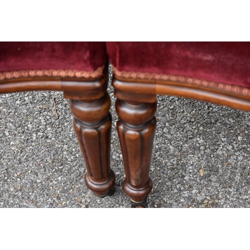 1073 - A set of four red upholstered dining chairs. Collection of this lot is strictly by appointment on Sa... 