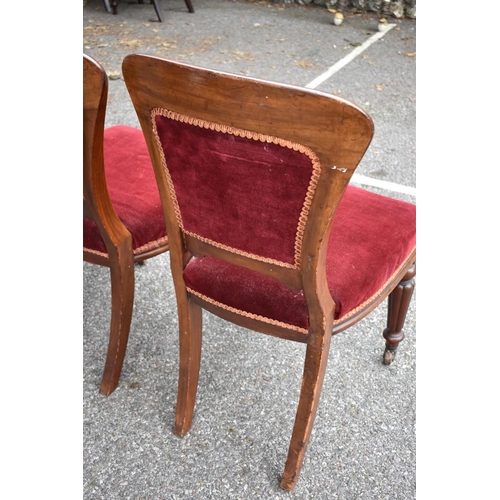 1073 - A set of four red upholstered dining chairs. Collection of this lot is strictly by appointment on Sa... 