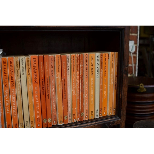 467 - PENGUINS: a collection of 70 Penguin editions of novels by Graham Greene, plus 60 other vintage... 