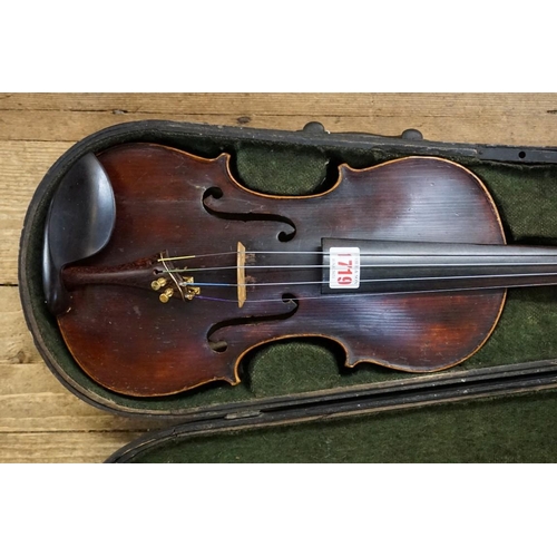 1719 - A antique German violin, labelled 'Antonius Stradivarius', with 14in two piece back, with bow and eb... 