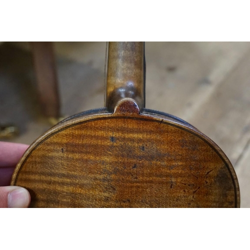 1720 - An antique Continental violin, labelled 'Nicolaus Amatus,...', with 14in one piece back, with bow an... 