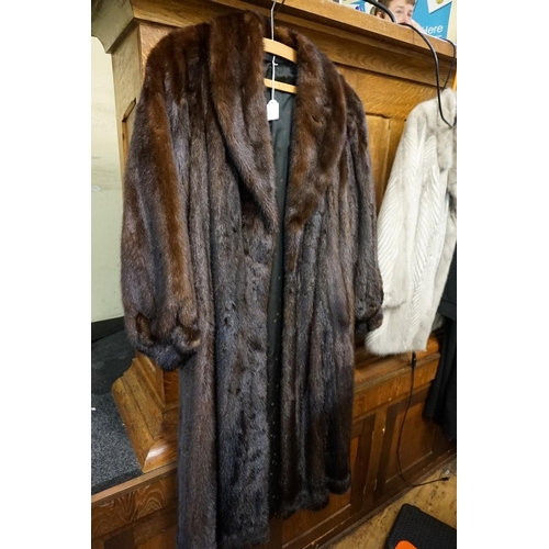 1728 - Withdrawn: A vintage long brown fur coat.