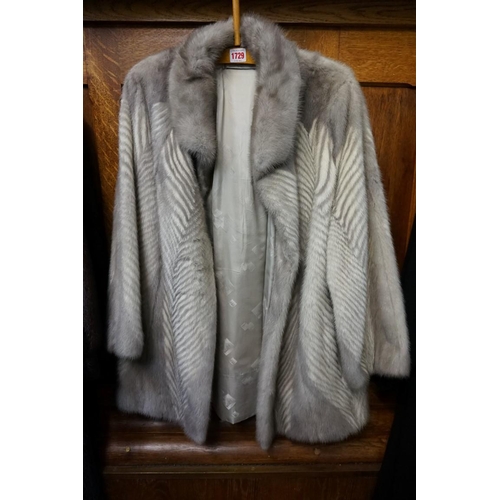 1729 - A vintage grey fur jacket. 