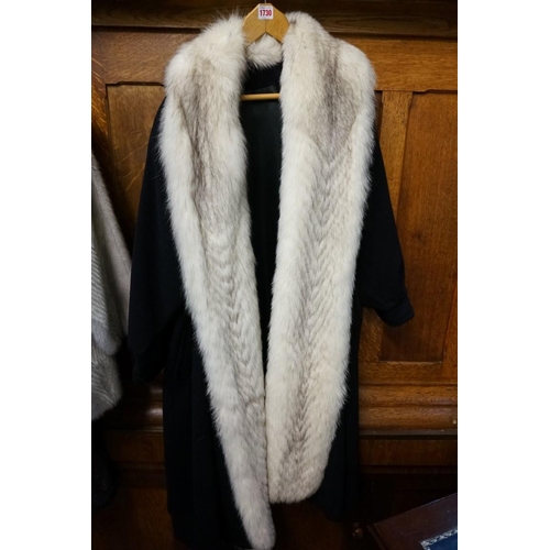 1730 - A vintage fur trimmed cashmere long coat; together with a mink fur hat, stoles, belts and related.... 