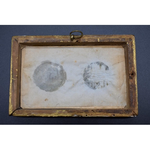 1721 - Indian School, a pair of portrait miniatures, on ivory, 2.8cm diameter, framed as one.... 