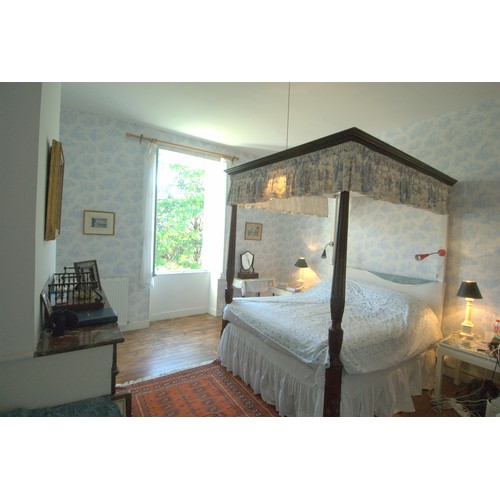 1063 - A four poster bed, with mattress, 228cm high x 233cm long. Collection of this lot is strictly by app... 