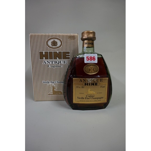 586 - A 24 fl.oz. bottle of Hine Vieille Fine Champagne cognac, probably 1960s bottling, in card box.... 