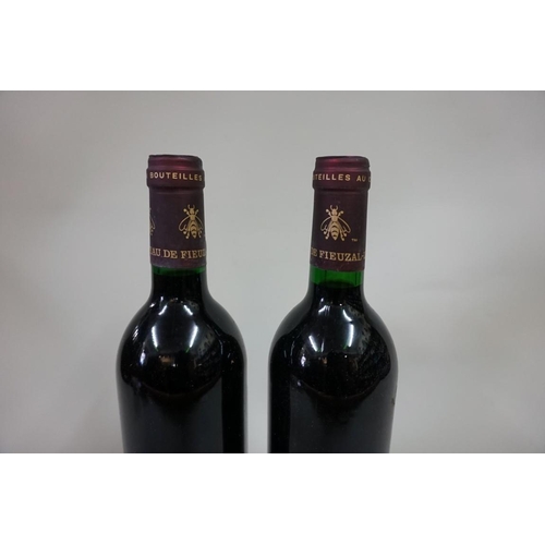 593 - Two 75cl bottles of Chateau de Fieuzal, 1986, Pessac-Leognan. (2)