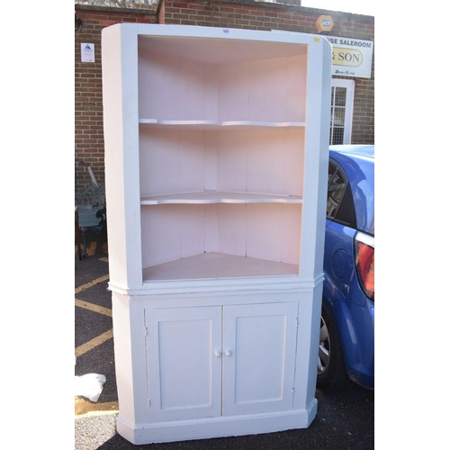 1055 - A painted pine corner cupboard, 192cm high x 114cm wide.