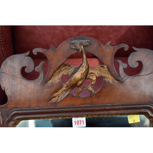 1071 - An 18th century fretwork mirror; together with a shield shaped toilet mirror.