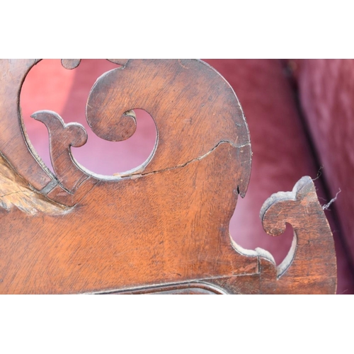 1071 - An 18th century fretwork mirror; together with a shield shaped toilet mirror.