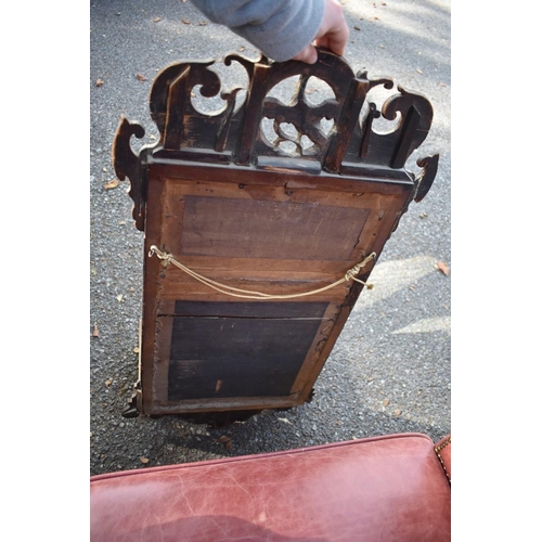 1071 - An 18th century fretwork mirror; together with a shield shaped toilet mirror.