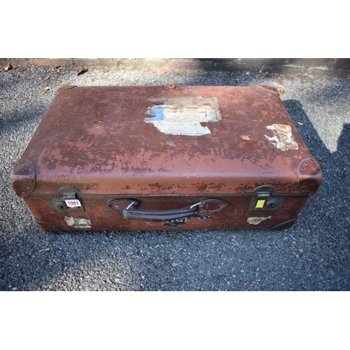 1081 - An old faux leather suitcase. 