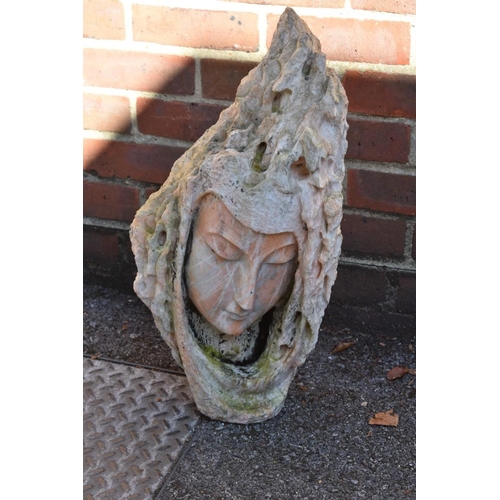 1090 - A marble garden ornament of a female head, stamped to reverse.