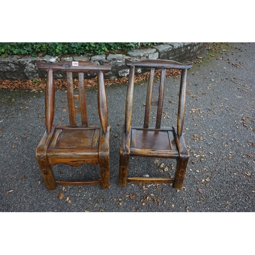 1098 - An unusual near pair of antique Chinese softwood child's chairs, largest 65cm high.