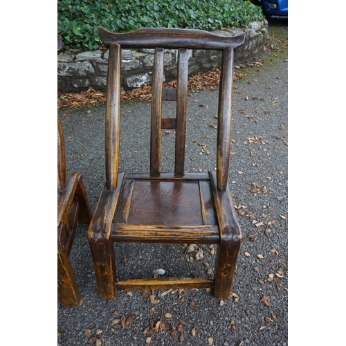 1098 - An unusual near pair of antique Chinese softwood child's chairs, largest 65cm high.