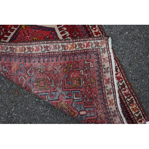1100a - A Persian runner, having seven central medallions, the central field decorated with flowers, 280 x 8... 
