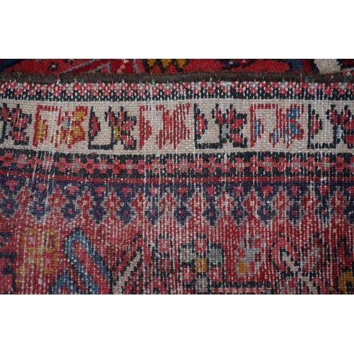 1100a - A Persian runner, having seven central medallions, the central field decorated with flowers, 280 x 8... 