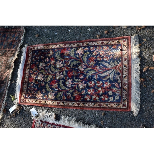 1103 - An Afghan rug, having allover geometric design; together with a small Bokhara rug and two other smal... 