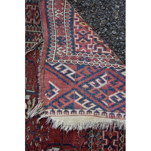1104 - (LC) A square Persian rug, having repeated medallions to central field, with geometric borders 122 x... 