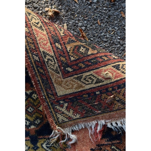 1105 - Two small Bokhara rugs; together with another small rug having geometric decoration.... 